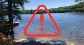 boat launch with caution symbol